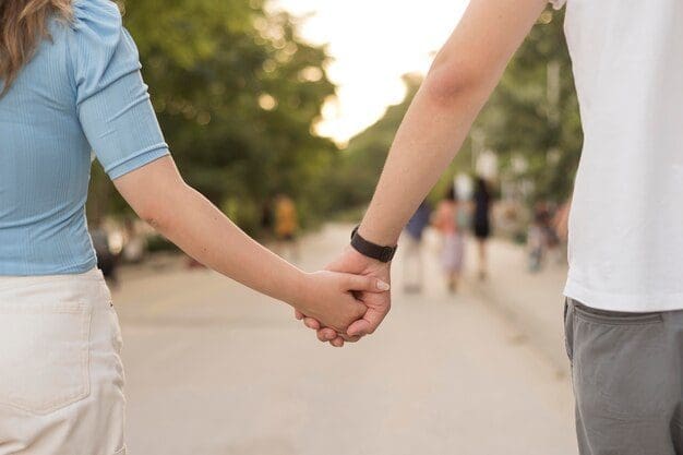 Couple holding hands