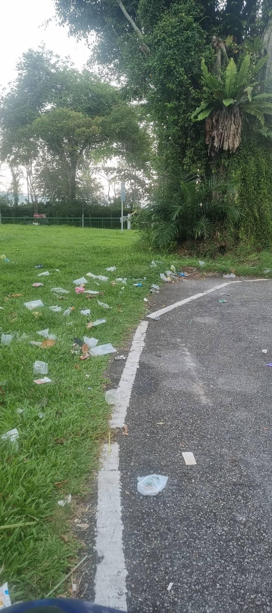 motorcyclist at littered spot in Singapore 