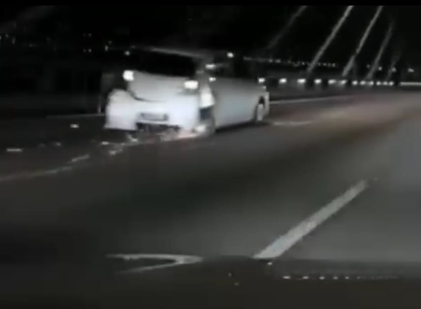 axia with severe dents and missing rear tire on penang bridge