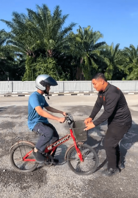 Instructor guiding him