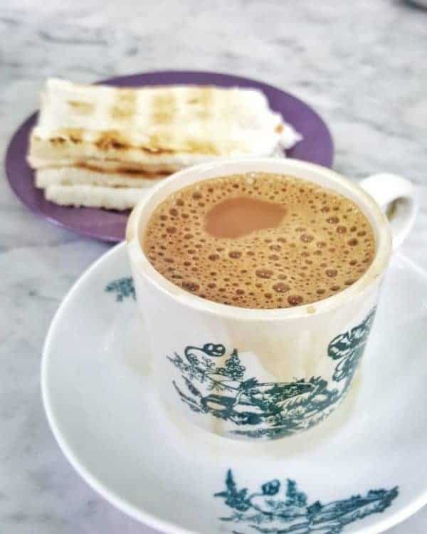 A cup of Ipoh white coffee with toast