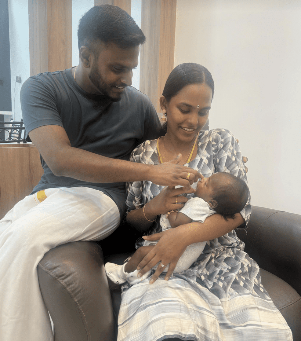 Kamysstra with her husband and baby