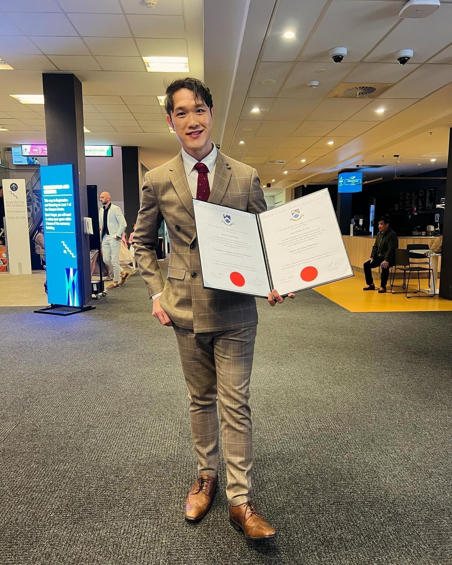 KC Leong holding his cert