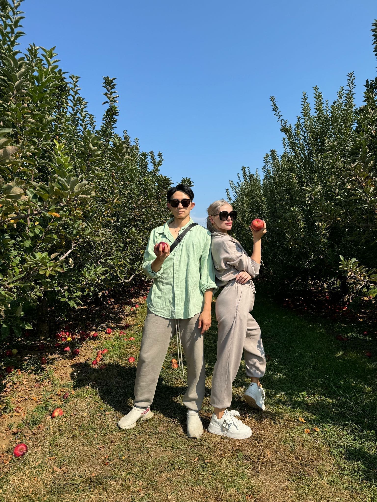 Kelvin and partner holding apple