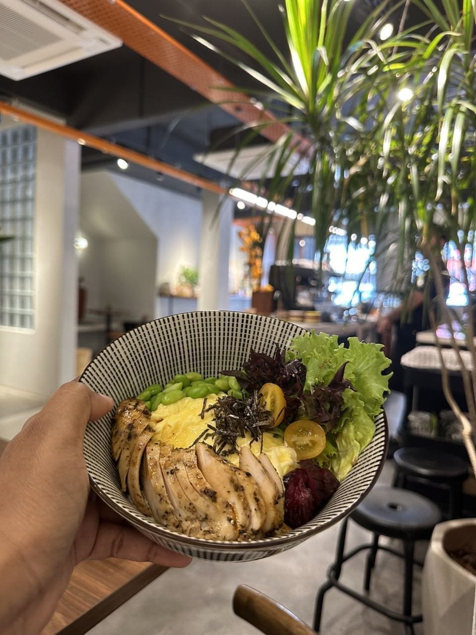 Smoked Duck ramen bowl at the orange couch cafe