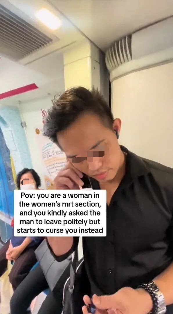 M'sian man pretends to talk on the phone while at the women's coach
