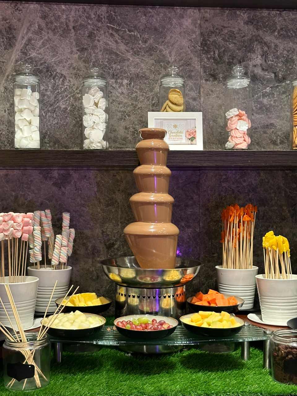 Chocolate fountain with many different toppings