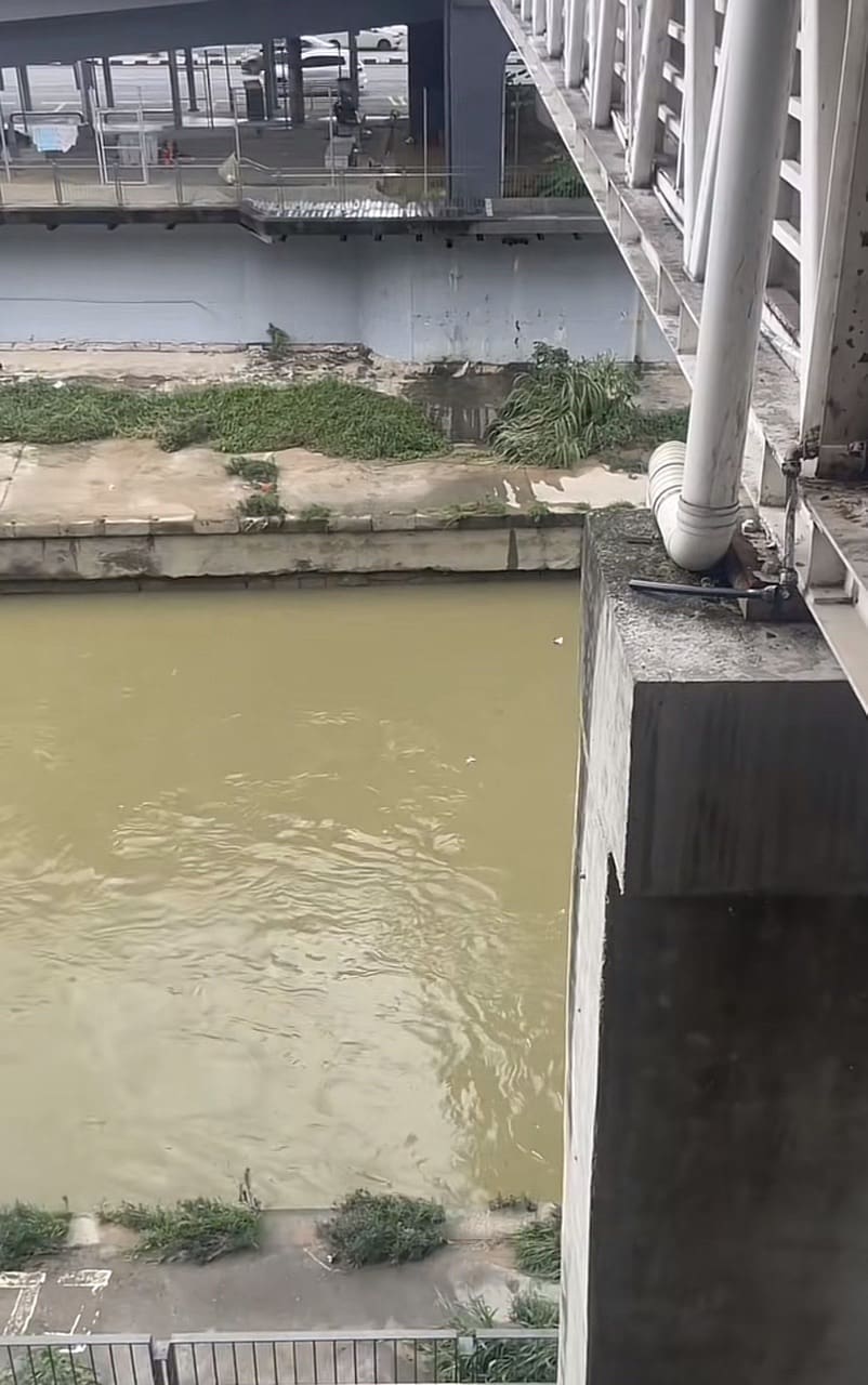 Rubbish thrown into the river near a LRT