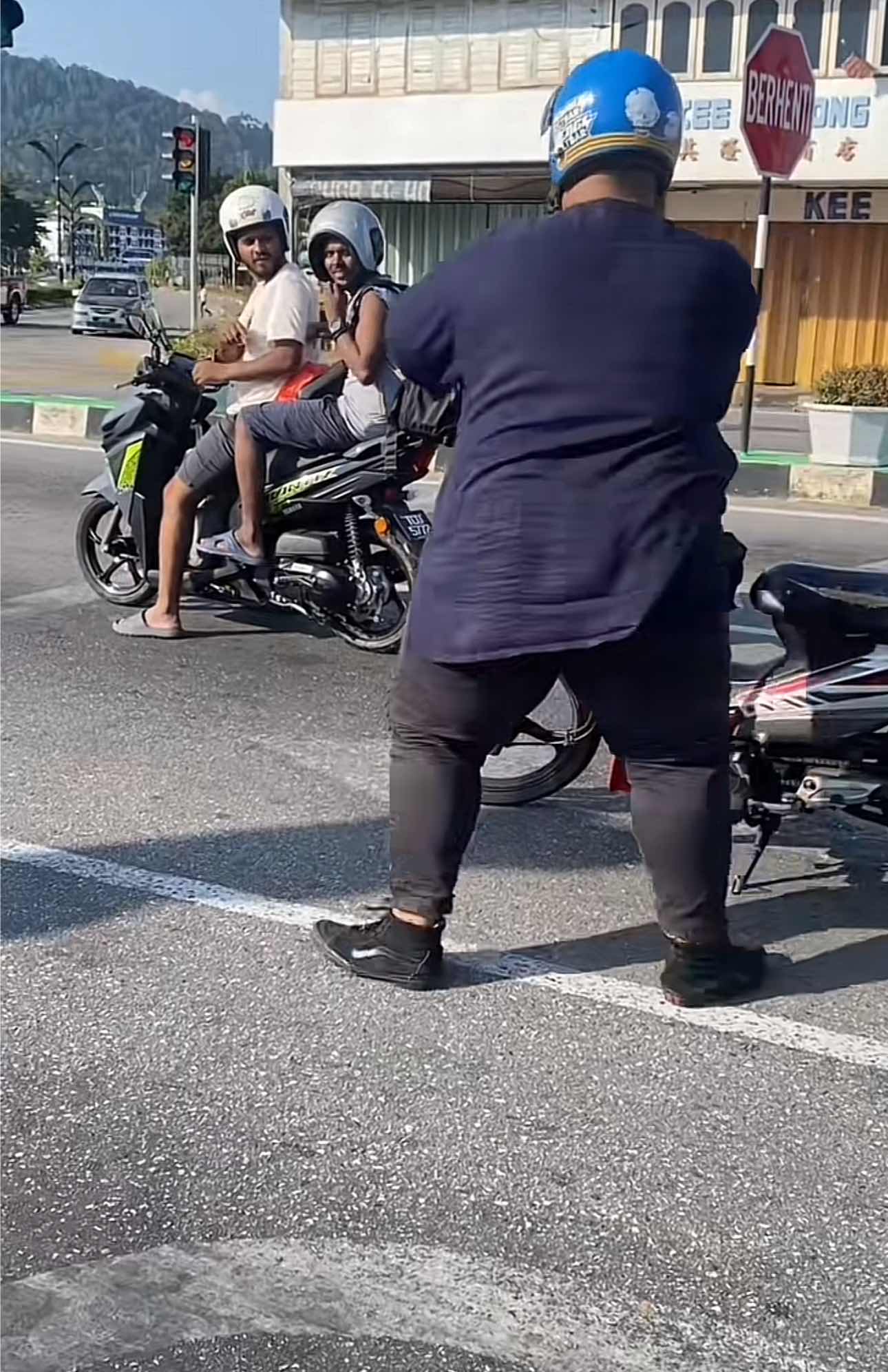 Man gets down his motor to help a boy