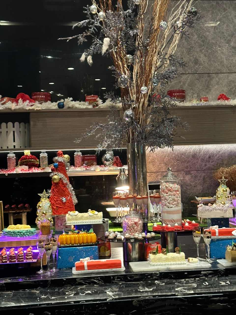 Christmas themed desserts on the table at a buffet at Sofitel Kuala Lumpur