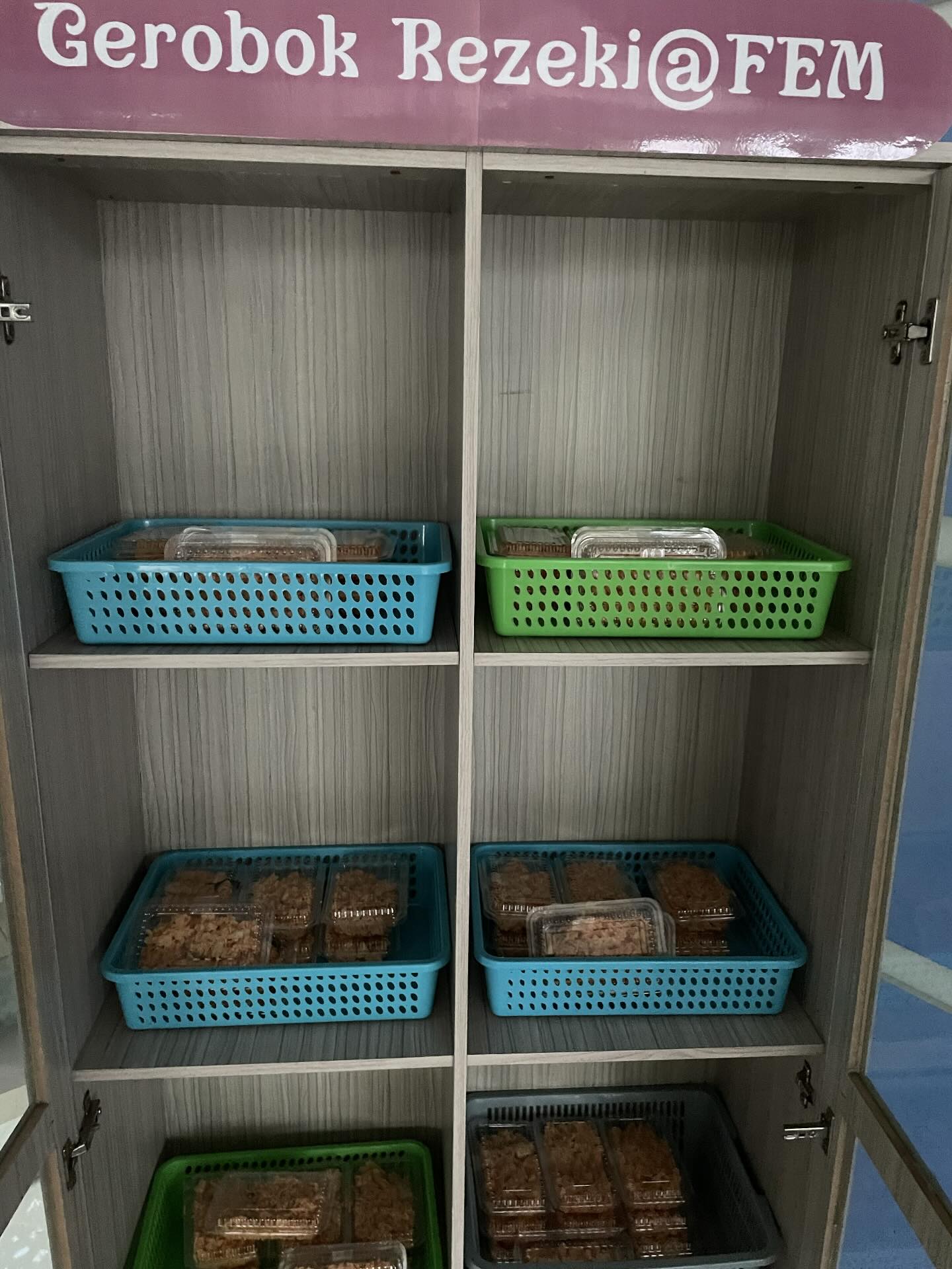 Lecturer puts food in cupboard 2