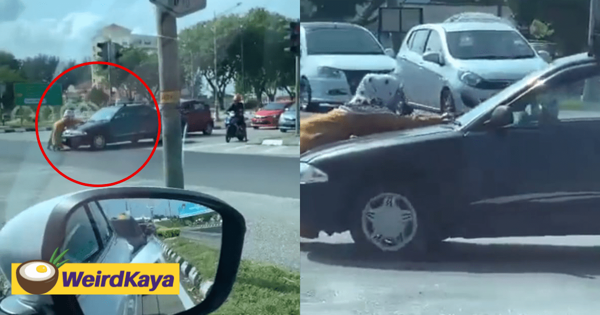 M'sian Woman Spotted Trying To Block Moving Car Near Traffic Light In Viral Video