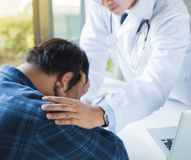 patient consoled by doctor
