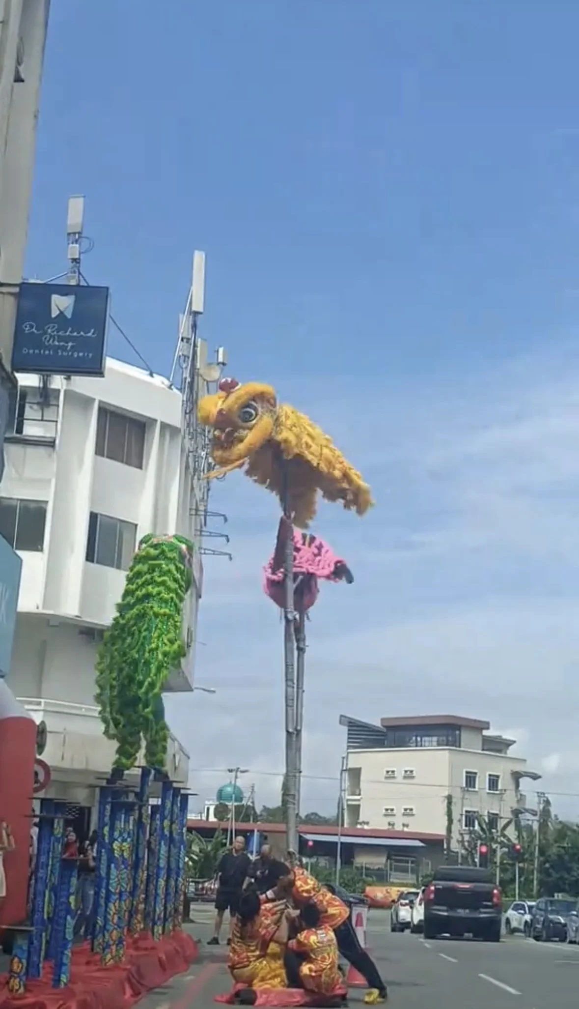 lion dancers on the pole