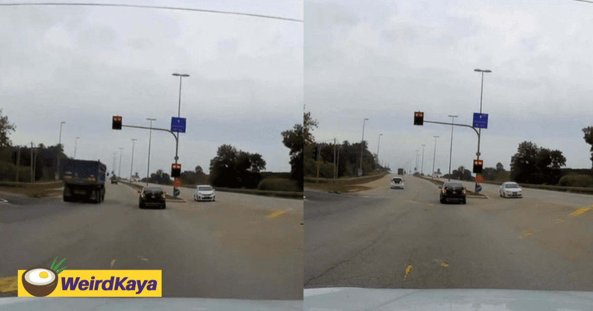 Lorry Runs Red Light While Toyota Vios Awkwardly Stops Mid-Intersection In Kuantan