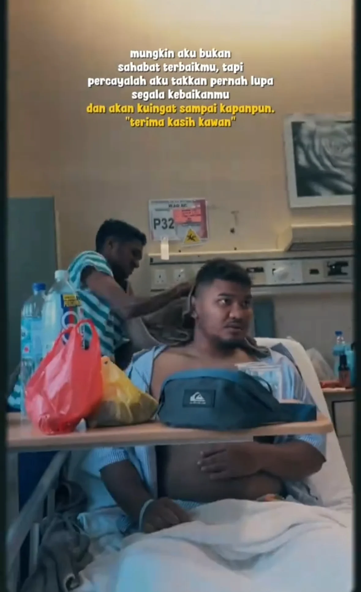 malaysian man wiping friend's body at hospital