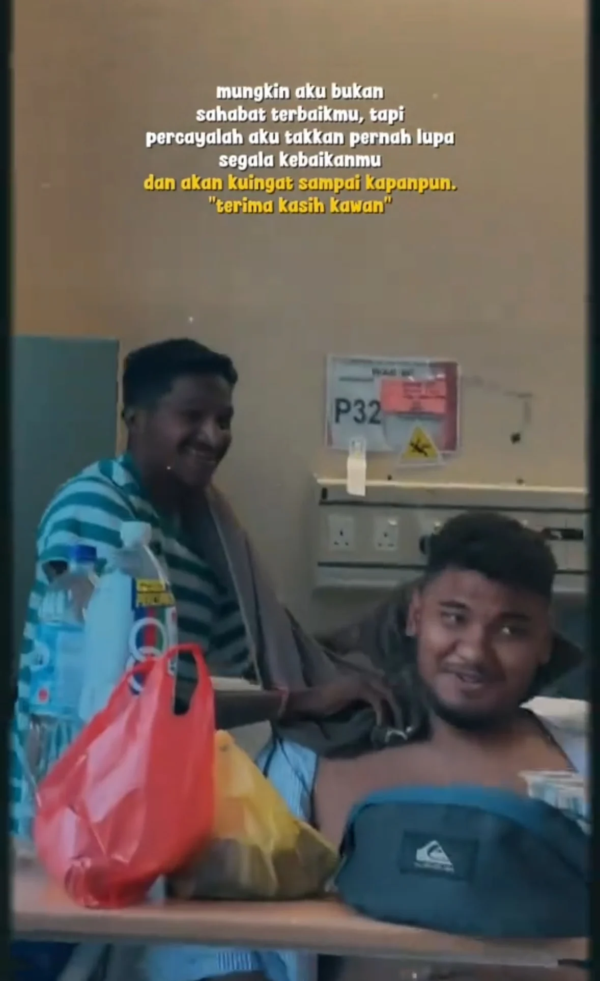 malaysian man wiping friend's body