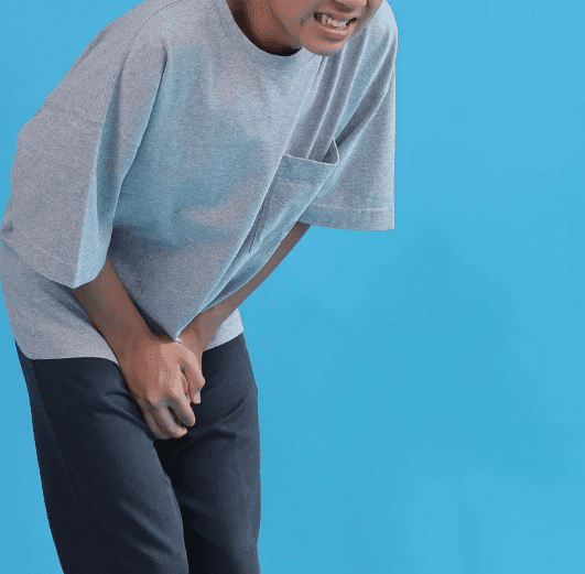 Man covering his crotch