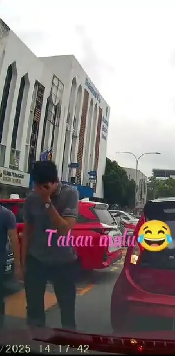 man covering while walking away from the car