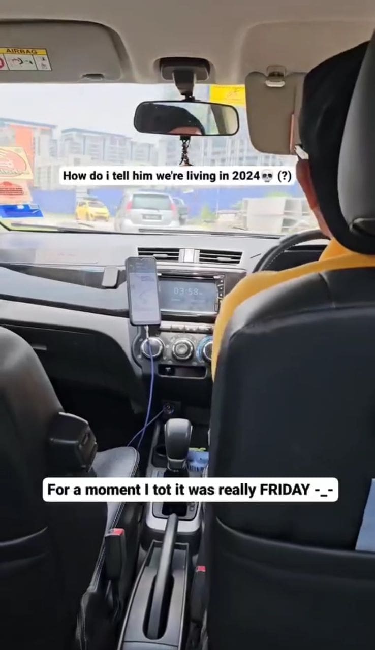 man driving a car