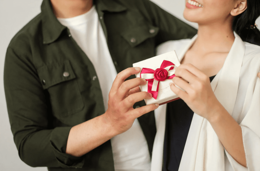 man giving partner a gift