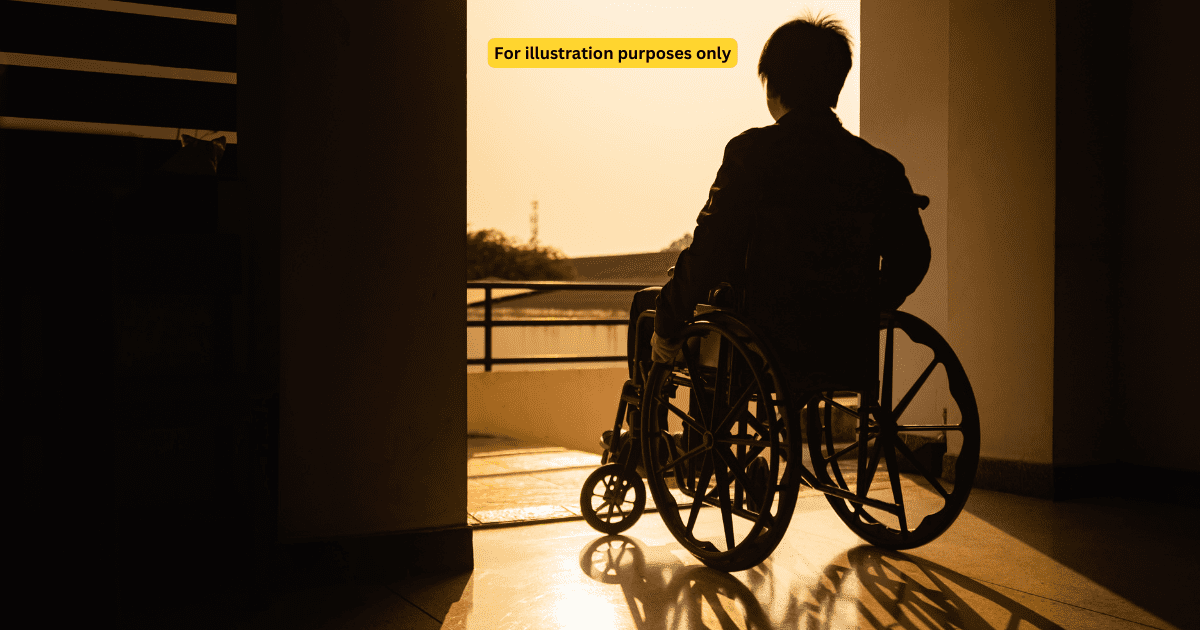 man in wheelchair in the evening