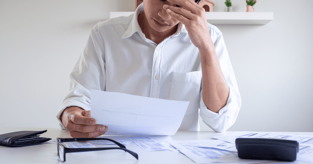 man looking at his bills (2)