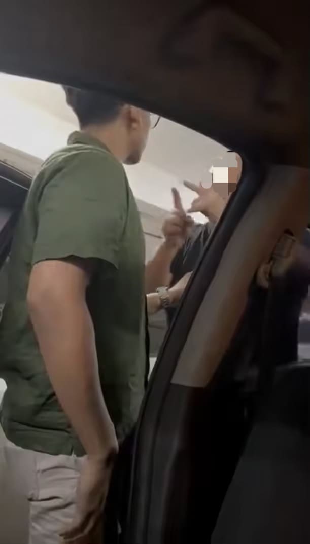 Man points finger at Megat