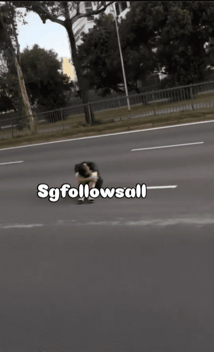Man sits in the middle of road in S'pore