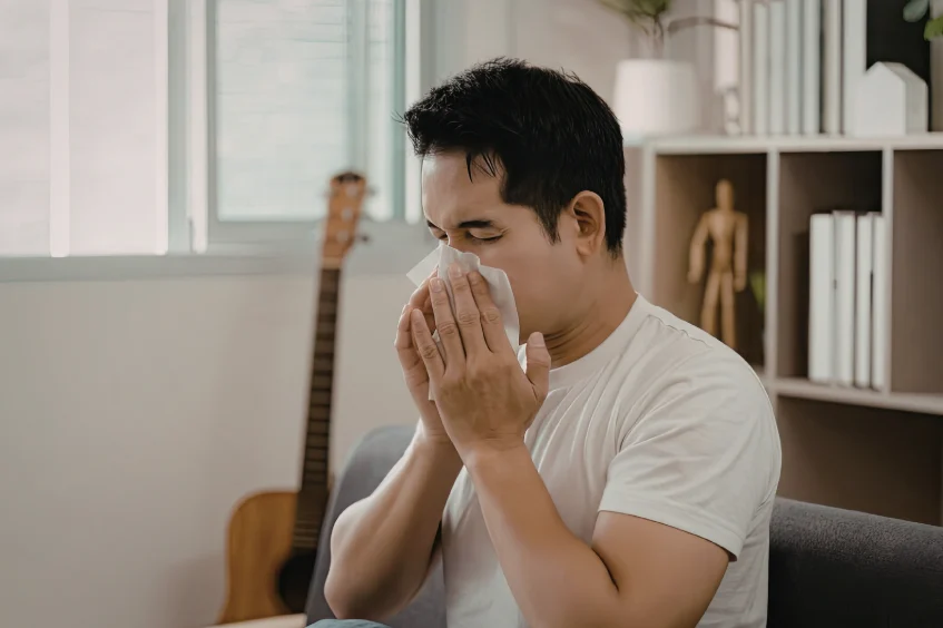 man sneezing