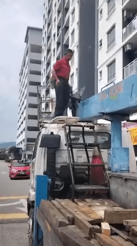 man standing on the crane
