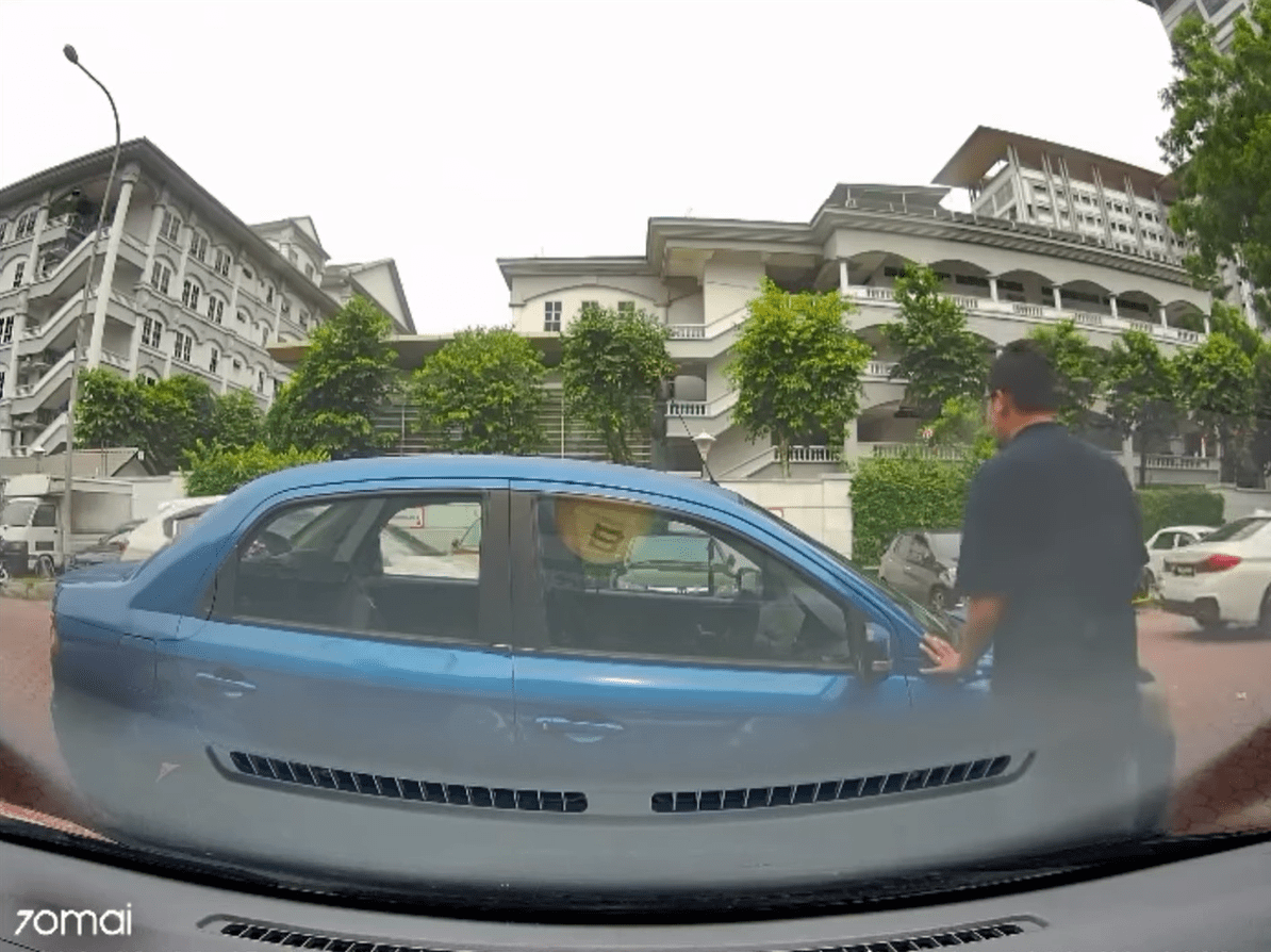Man tries to move double-parked Proton Waja