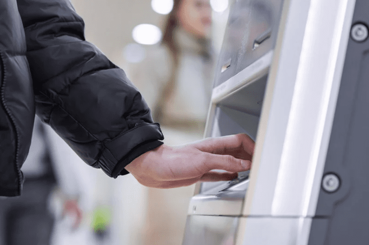 Man using ATM machine