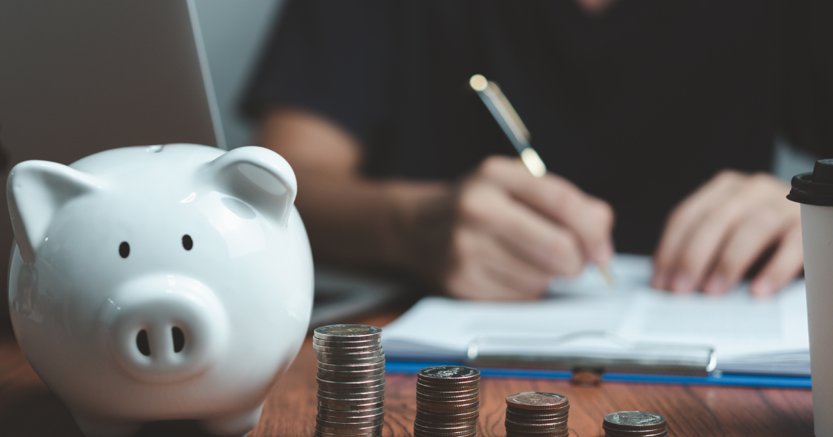 man with piggy bank on the table