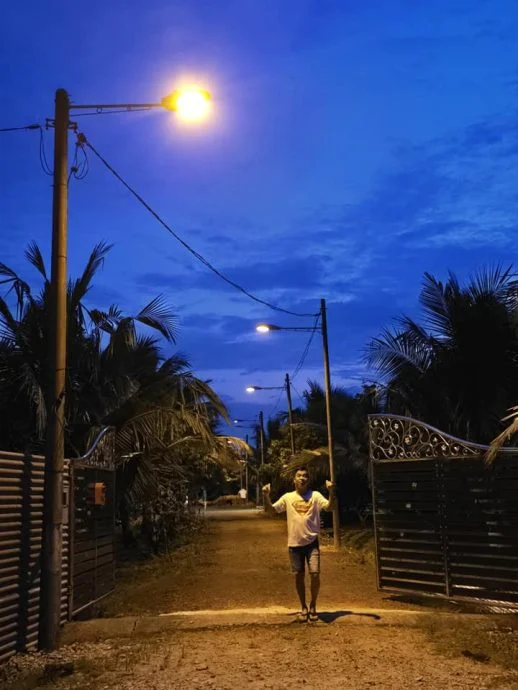 Man with the street lamp
