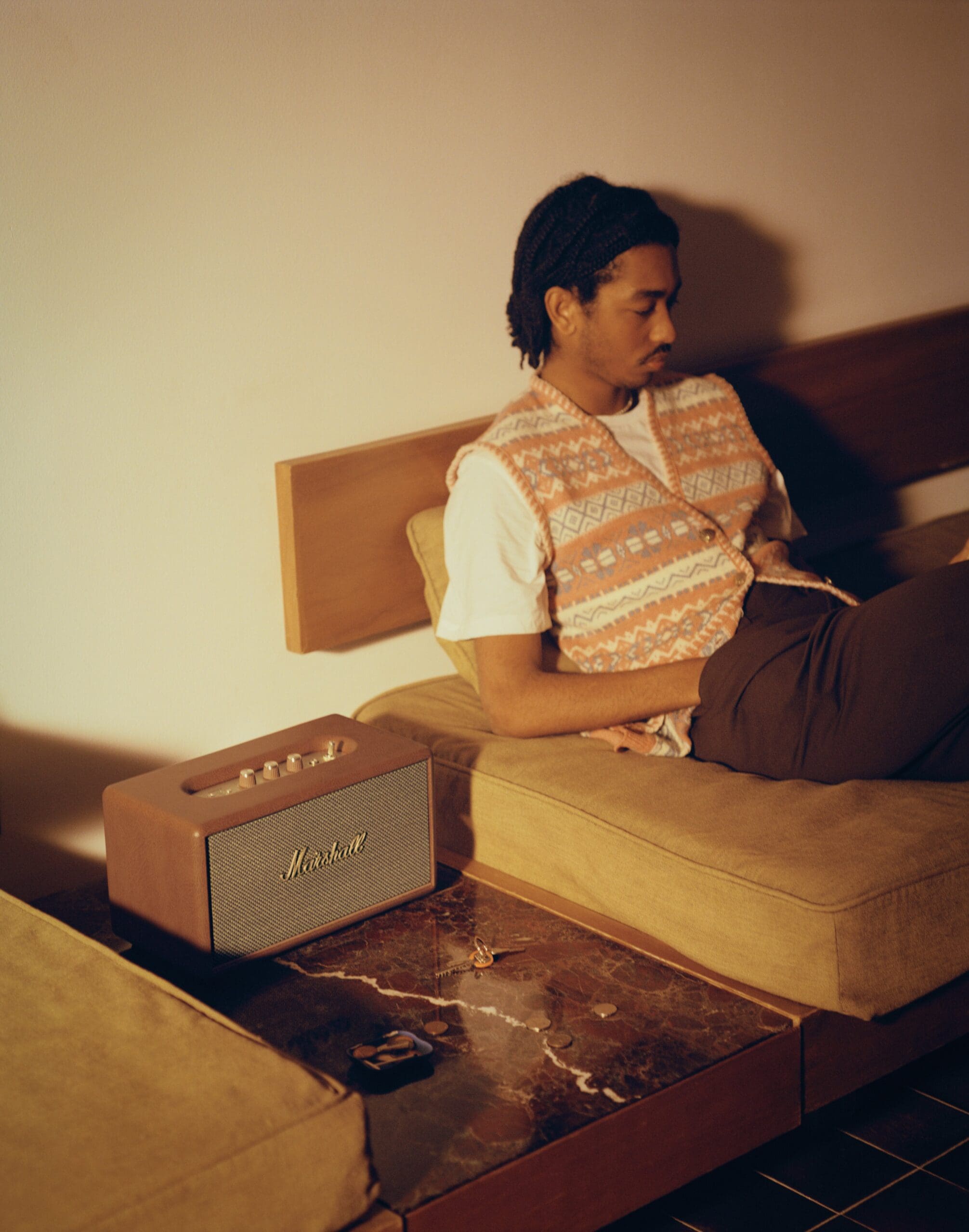 Man listening to music using Marshall Homeline III