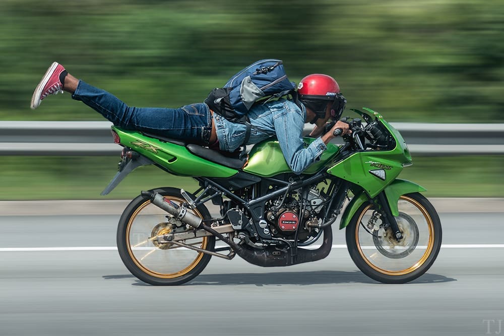 Mat rempit doing the 'Superman' stunt
