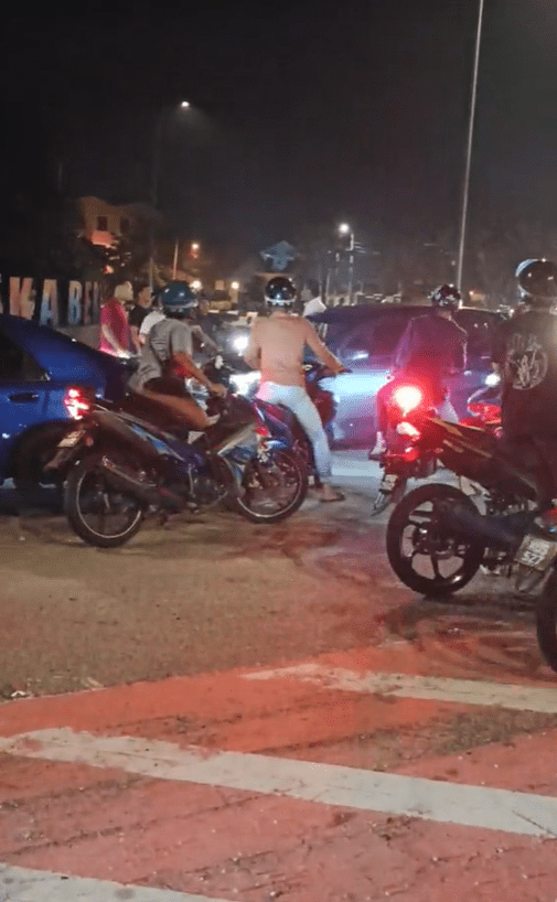 Mat rempits surround Axia driver