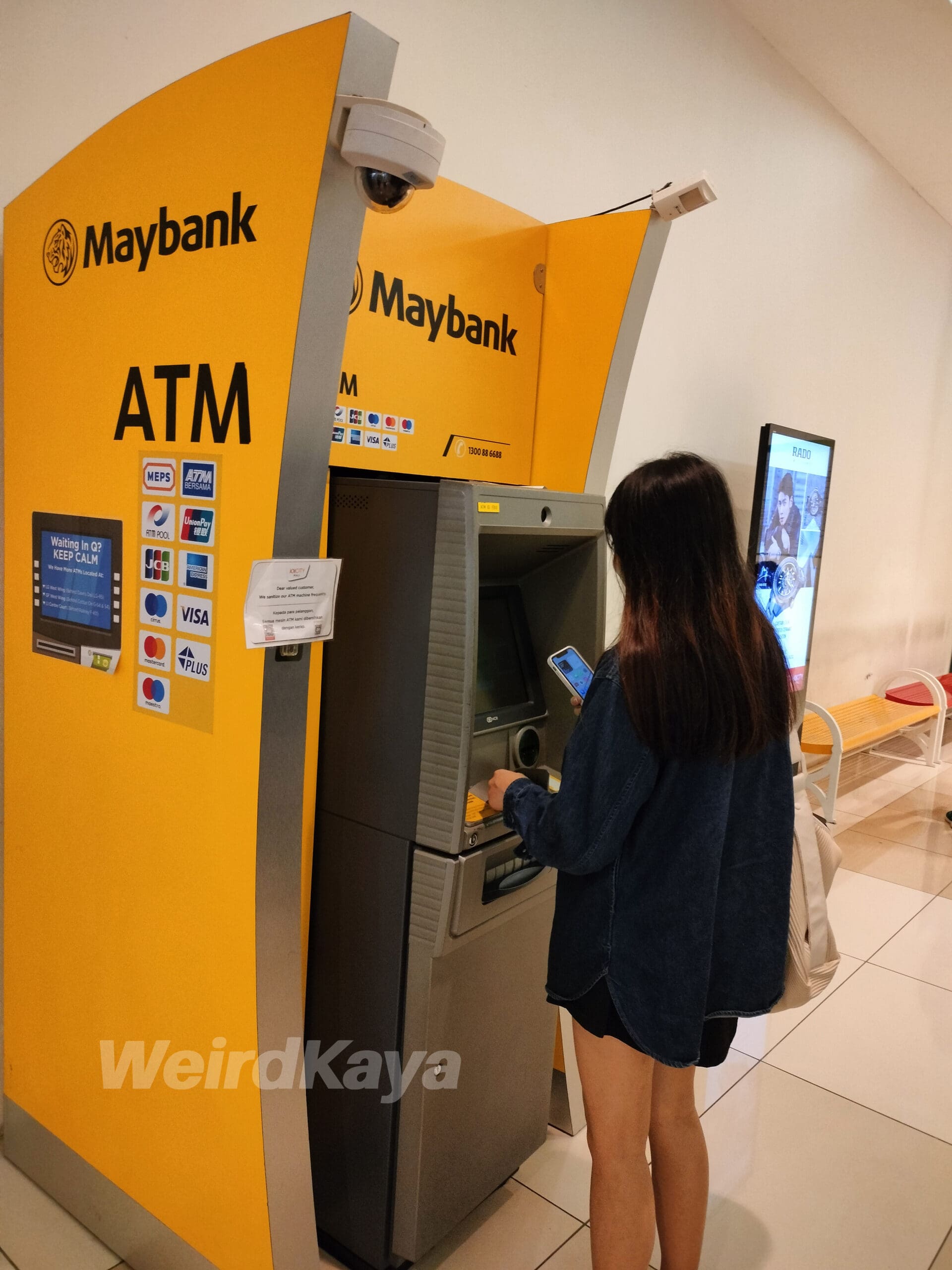 maybank atm woman using atm
