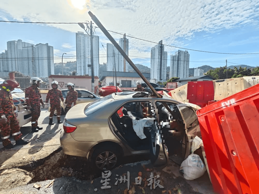 Metal pole skewers car in Penang