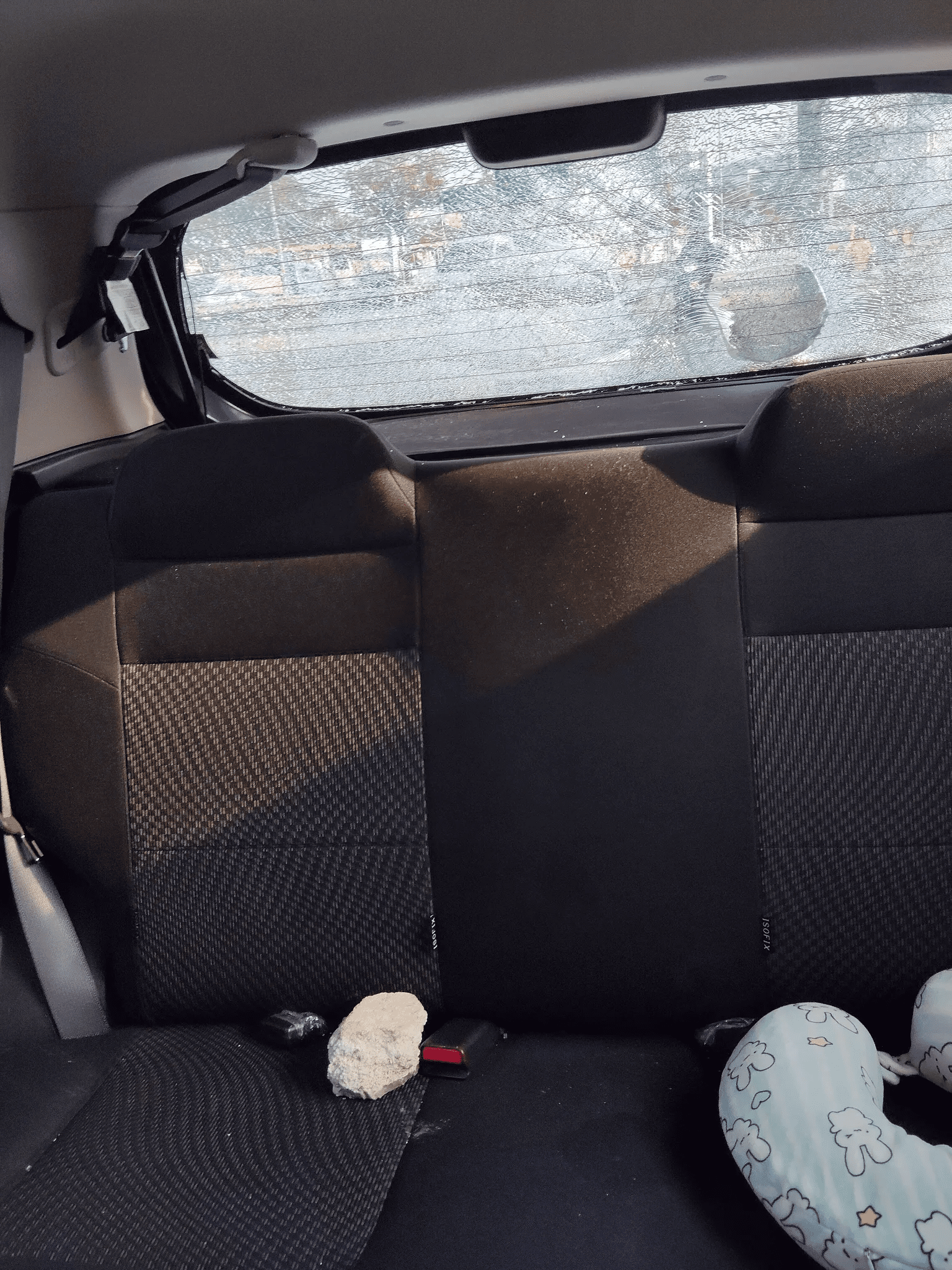 Motorcyclist throws rock at car 2