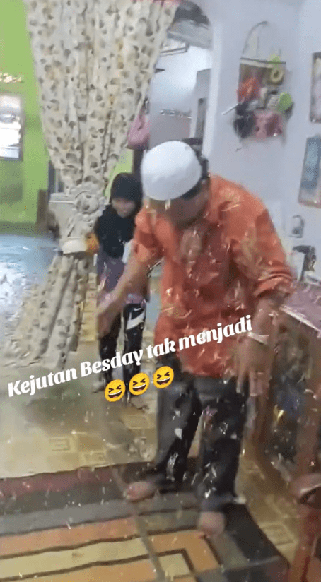 msian family celebrating father's birthday