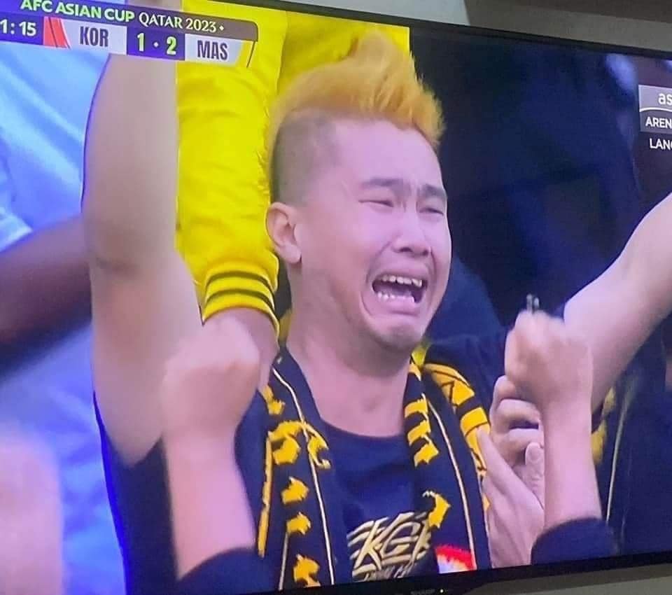 M'sian football fan Derrick Gan cries at M'sian match at Asian Cup in Qatar