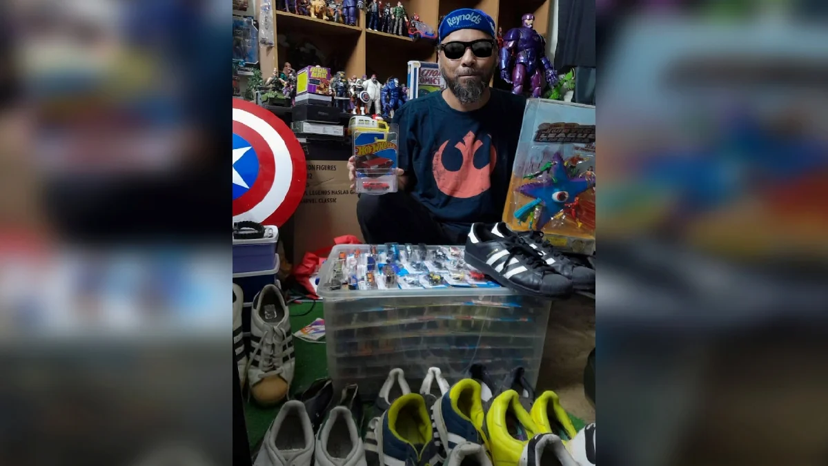msian man showing his hot wheels collection