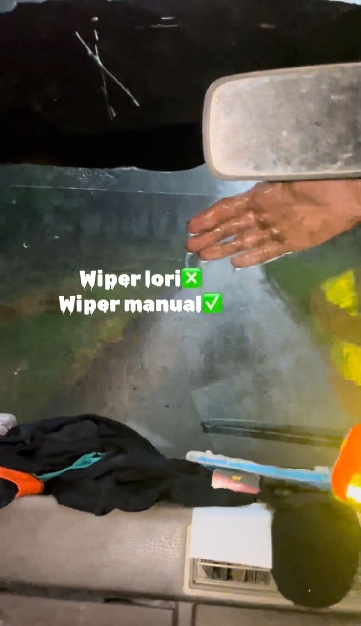 msian man using hand as a wiper