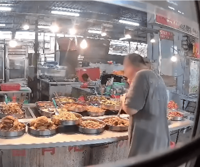 M'sian mixed rice stall owner caught using same spoon to taste dishes