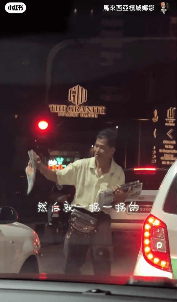 M'sian uncle tries to sell newspapers at Penang