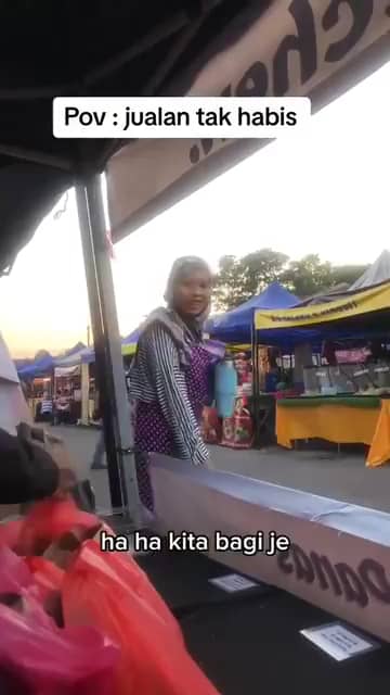 msian woman at a stall at bazaar
