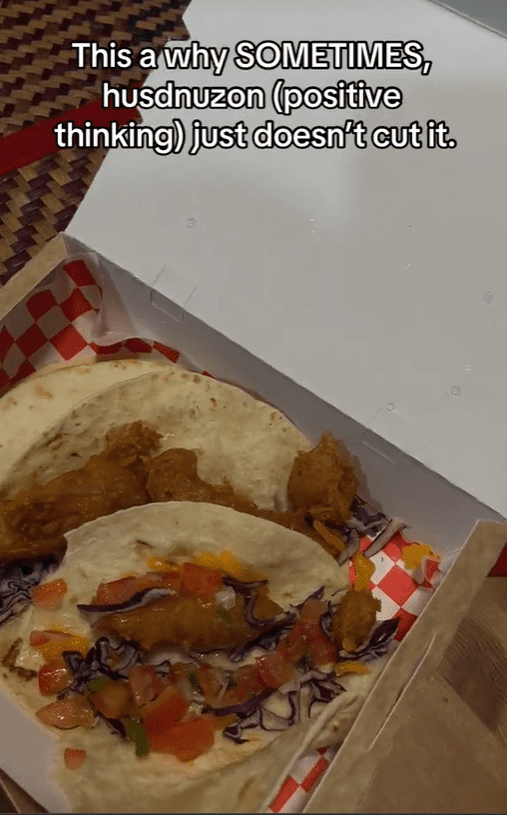 M'sian woman picks through fish tacos