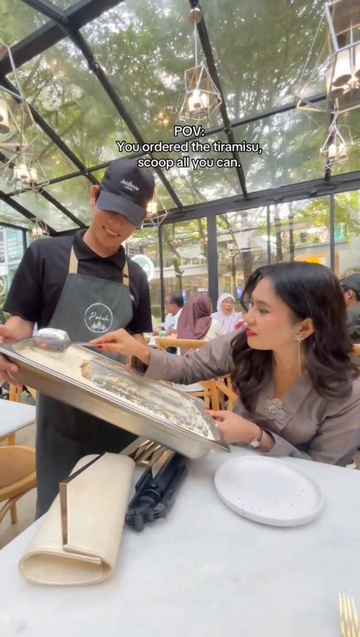 msian woman scoops tiramisu in all you can scoop viral promo kl cafe pic1